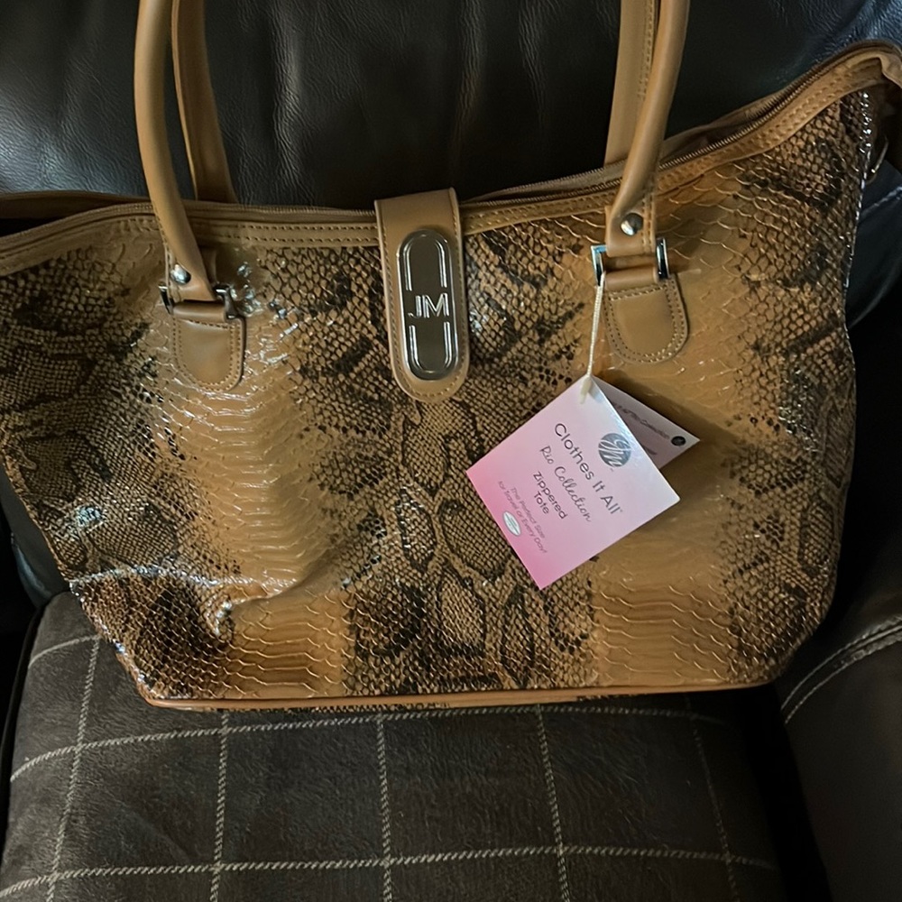 Brown snake skin zippered tote .